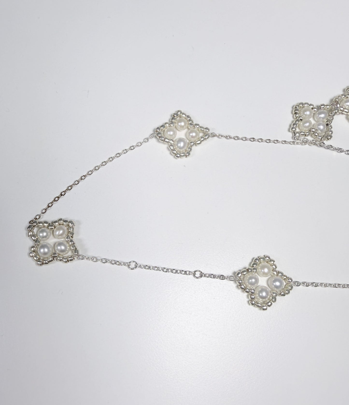 Four-leaf clover sweater chain