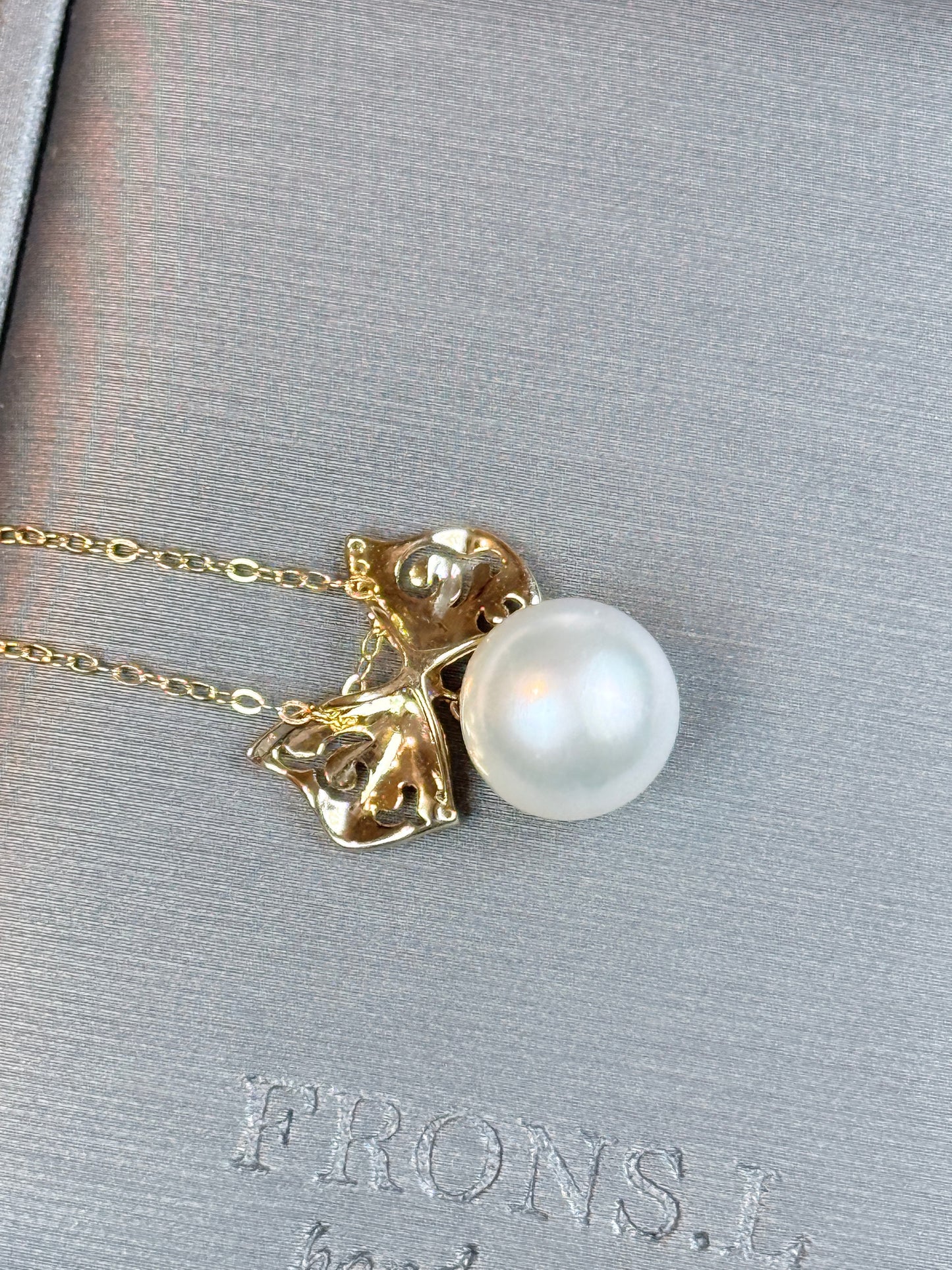 Bow South White near round Sea Pearl pendant